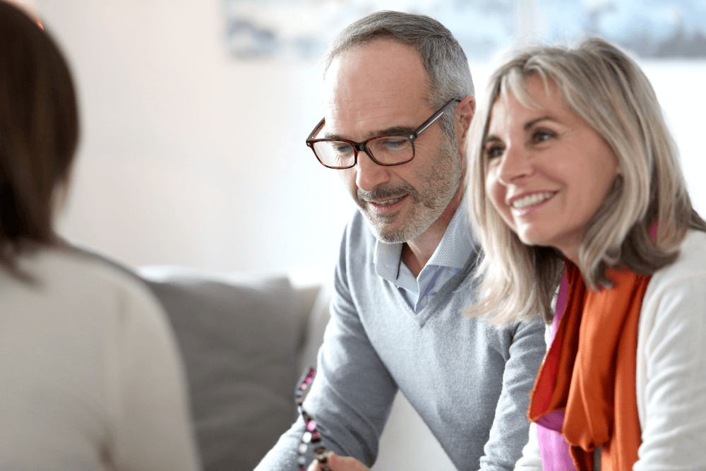 Elderly couple speaking to a lawyer