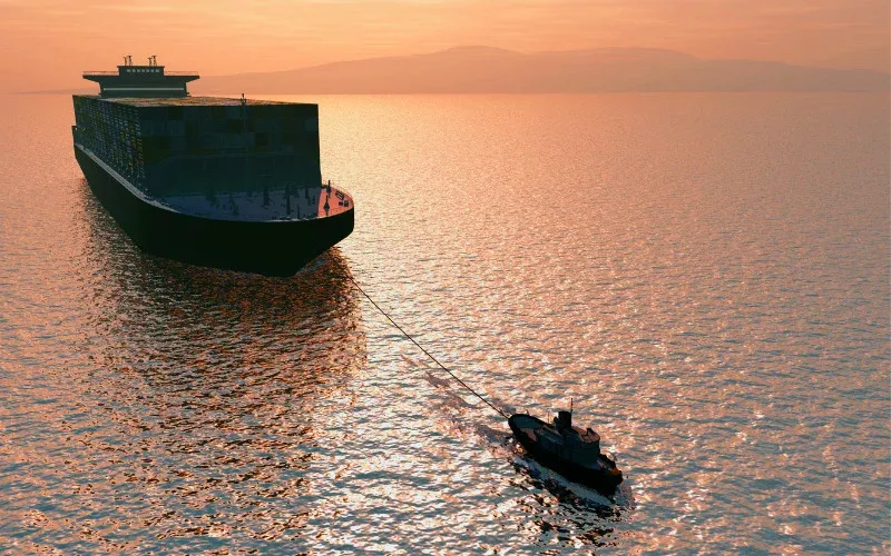 tug boat towing a cargo ship