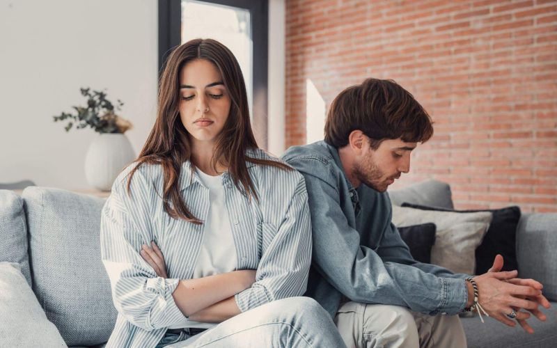 a man and a woman sitting on a couch