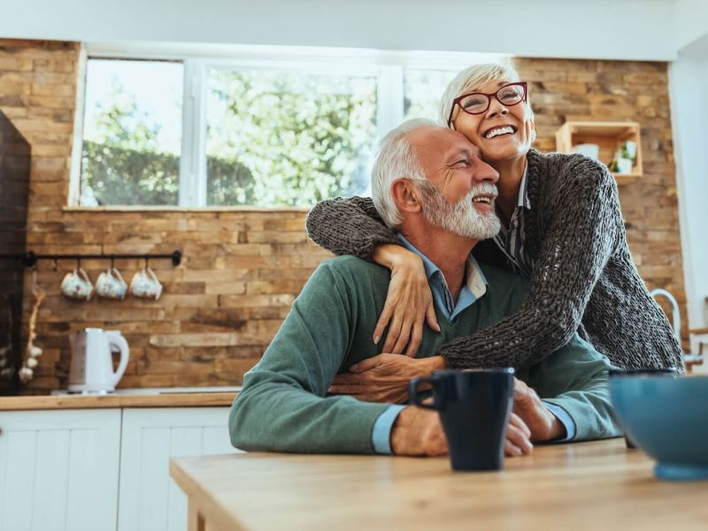 older couple happy and hugging