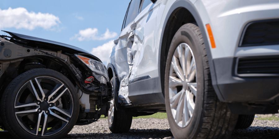 Two cars that have been involved in a t-bone collision