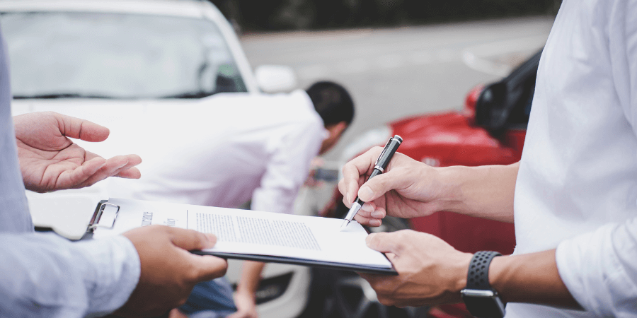 car accident evaluation forms being filled out