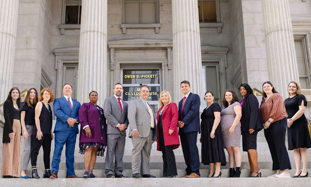 Montagna Law Virginia Law Firm Team standing on the steps of the Norfolk courthouse
